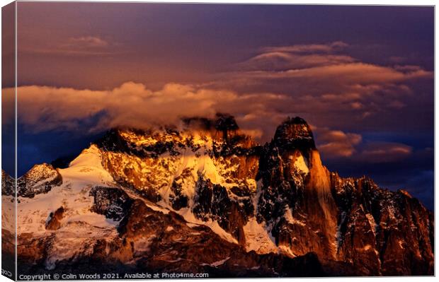 Clouds on the summit of the Aiguille Verte at Sunset Canvas Print by Colin Woods