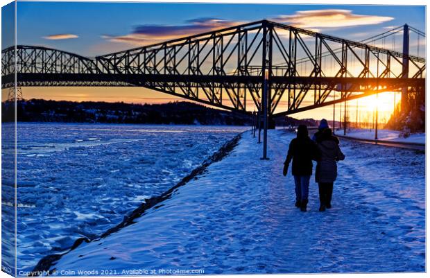 Walking by the frozen St Lawrence river in Quebec City, Canada Canvas Print by Colin Woods