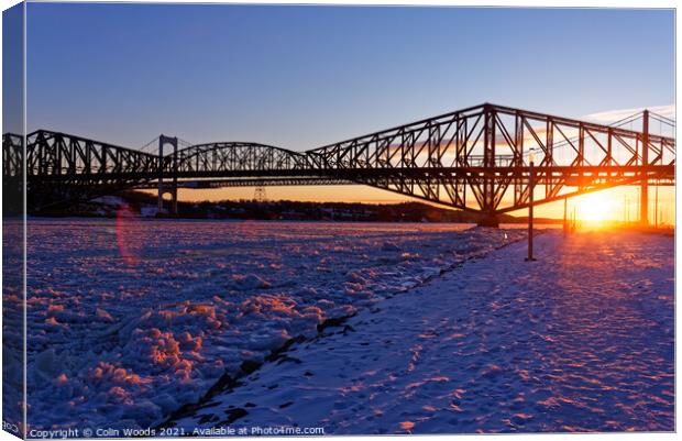 Sunset on the frozen St Lawrence river, Quebec Canvas Print by Colin Woods