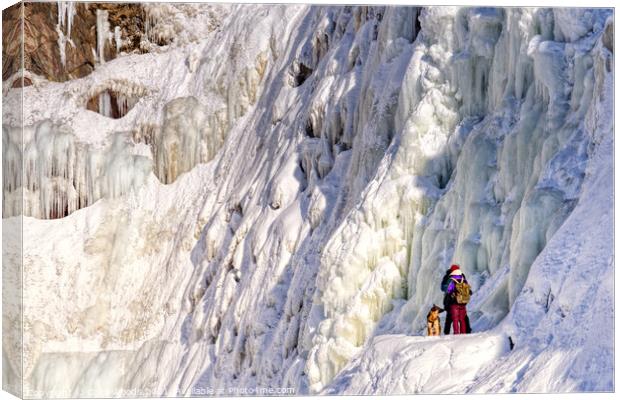 OutdTwo people with their dog at the frozen Chutes de Chaudière at Charny near Quebec City, Canadaoor  Canvas Print by Colin Woods