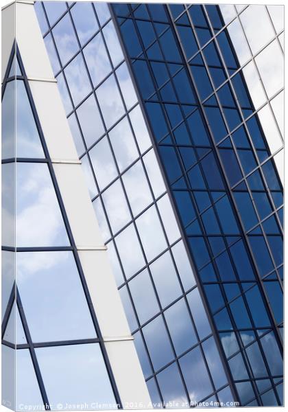 Glass office building sky reflections Canvas Print by Joseph Clemson