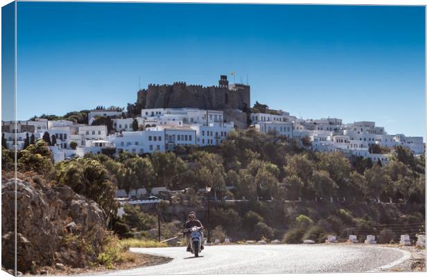 PATMOS, GREECE - SEPTEMBER 25, 2016: A moped drive Canvas Print by George Cairns