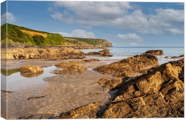 A rocky beach at pendower cornwall Canvas Print by Kevin Snelling
