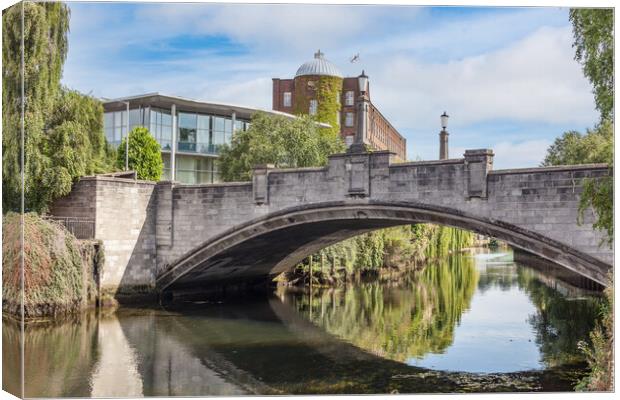 The River Wensum And Whitefriars Bridge In Norwich Canvas Print by Kevin Snelling