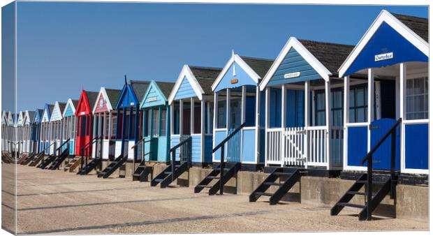 Colourful Beach Huts on Southwold Beach Canvas Print by Kevin Snelling
