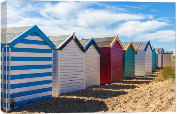Bright and Vibrant Seaside Cabins Canvas Print by Kevin Snelling