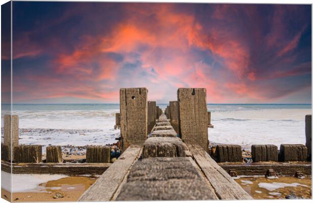  Wooden Groynes on the Norfolk Coast Canvas Print by Kevin Snelling