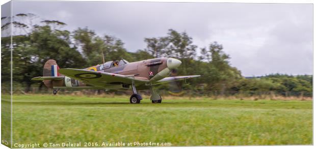 Low down for a Spitfire take-off Canvas Print by Tom Dolezal