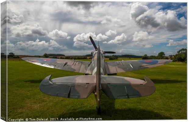 Spitfire under a Kentish sky Canvas Print by Tom Dolezal