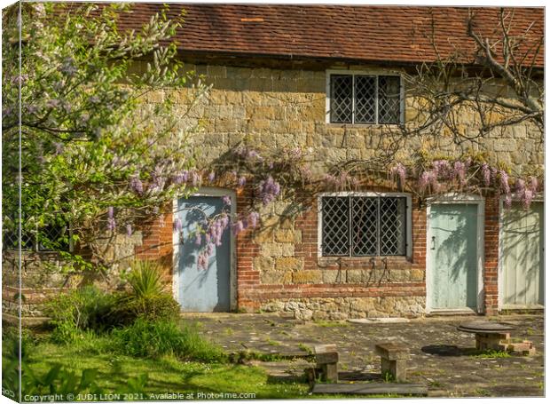 Stone Cottage and Wisteria Canvas Print by JUDI LION