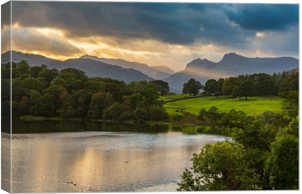 Sunset over Loughrigg Tarn in Lake District Canvas Print by Steve Heap