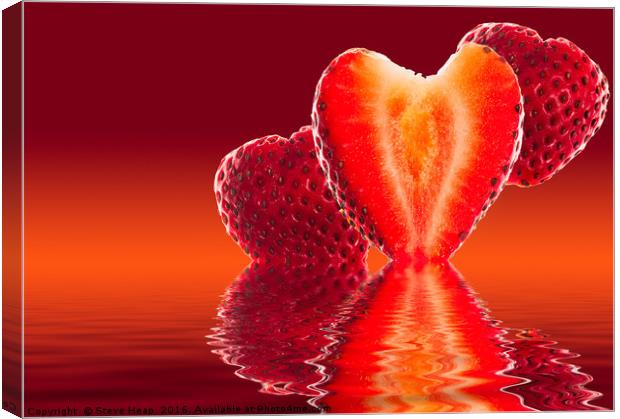 Fresh sliced strawberry in heart shape reflected Canvas Print by Steve Heap