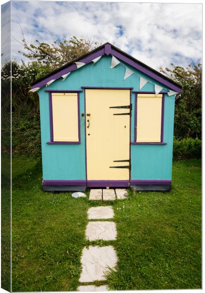 Colorful beach side huts on Devon coast of England Canvas Print by Steve Heap