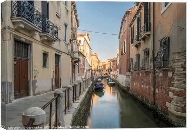 Typical Venetian canal, early in the morning.  Canvas Print by Gary Parker
