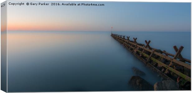 Breakwater at sunset Canvas Print by Gary Parker