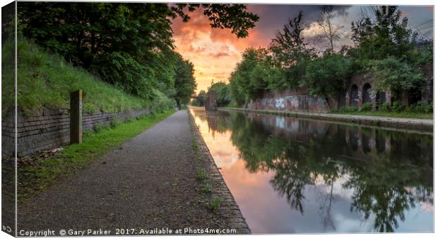 Dramatic sunset over a calm Birmingham Canal Canvas Print by Gary Parker