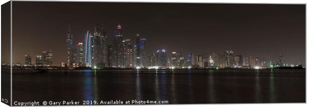 Skyscrapers of Dubai Marina at night.  Canvas Print by Gary Parker