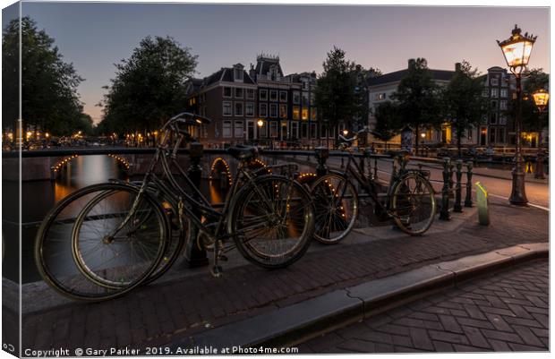 Amsterdam canal and bridge, at dusk.  Canvas Print by Gary Parker