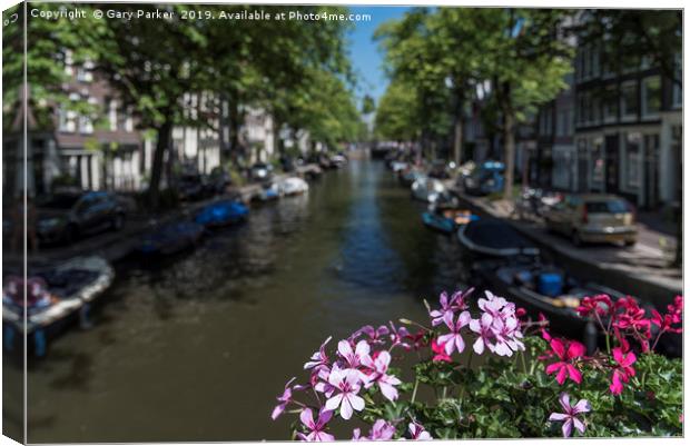 Summer flowers overlooking a canal in Amsterdam Canvas Print by Gary Parker