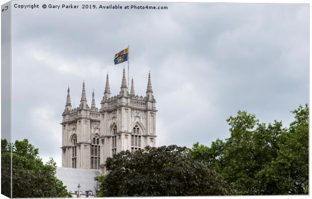 English cathedral tower above green foliage Canvas Print by Gary Parker