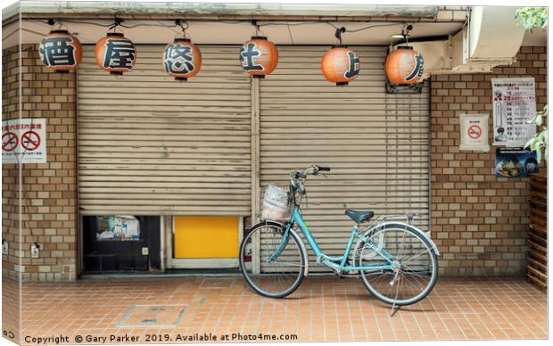 A single bicycle outside a closed shop in Tokyo Canvas Print by Gary Parker