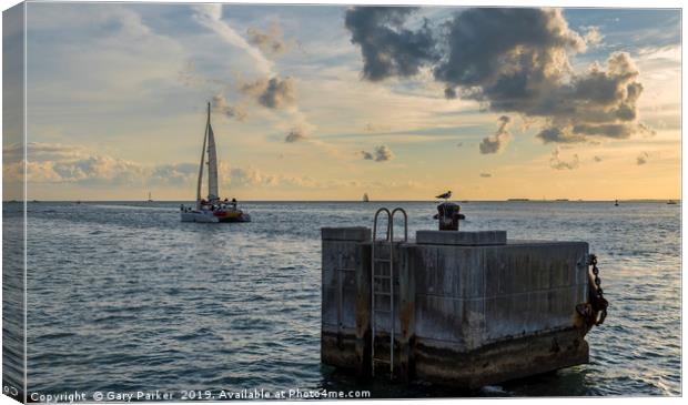 Catamaran, sailing towards the horizon Canvas Print by Gary Parker