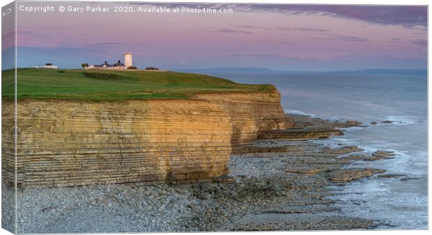 Nash Point lighthouse, south Wales, at sunset. Canvas Print by Gary Parker