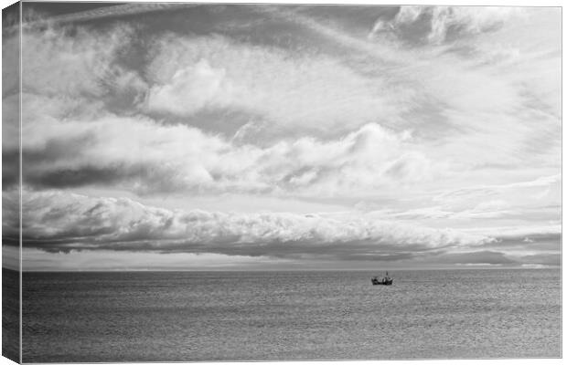 Lone Boat Under Cloudy Sky Canvas Print by Rob Cole