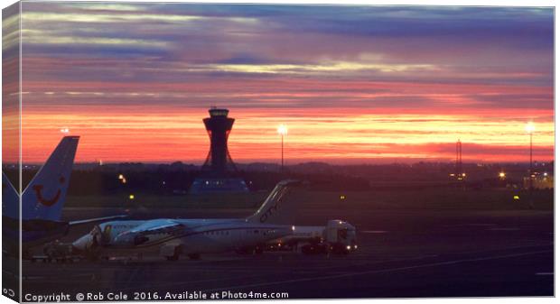 A fiery dawn at Newcastle Airport Canvas Print by Rob Cole