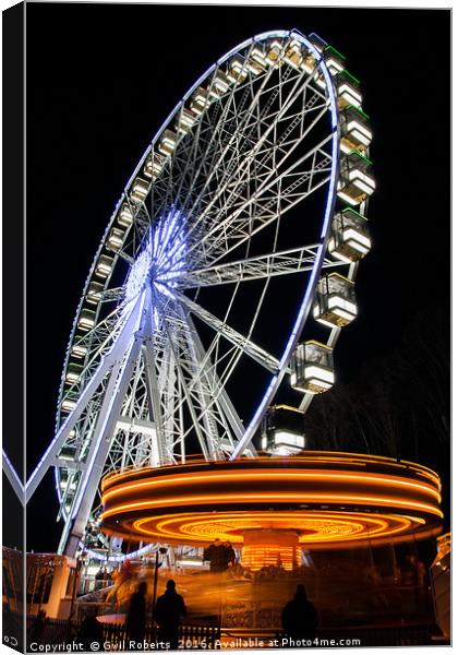 Ferris wheel and Carousel Canvas Print by Gwil Roberts