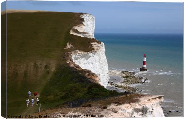 Hikers on the South Downs Way near Beachy Head Canvas Print by James Brunker