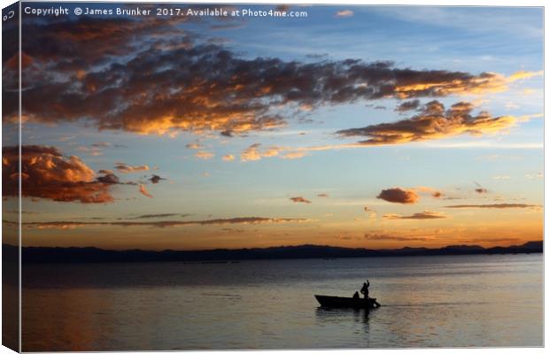 Fishing on Lake Titicaca Under a Fiery Sunset Canvas Print by James Brunker