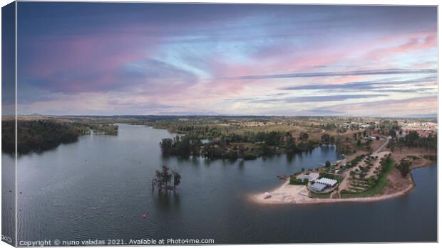 Aerial view from a lake with a beach at the sunset. Canvas Print by nuno valadas