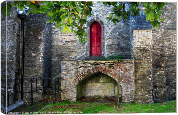 A small red church door located in Padstow, Cornwall, UK Canvas Print by Joy Walker