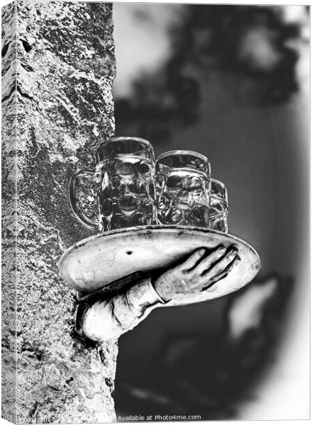 A model of a disconnected hand and beer glasses balanced on a tray Canvas Print by Joy Walker