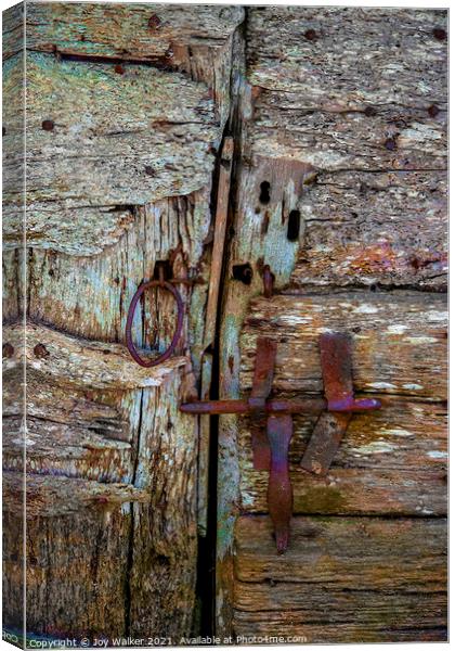 Detail of an old barn door showing the bolt and handle in a closed position Canvas Print by Joy Walker