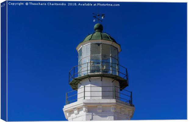 Deserted lighthouse against blue background. Canvas Print by Theocharis Charitonidis