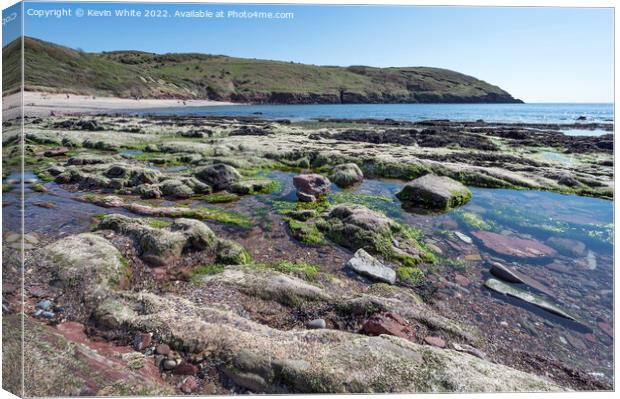 Rock pools at Manorbier Beach South Wales Canvas Print by Kevin White