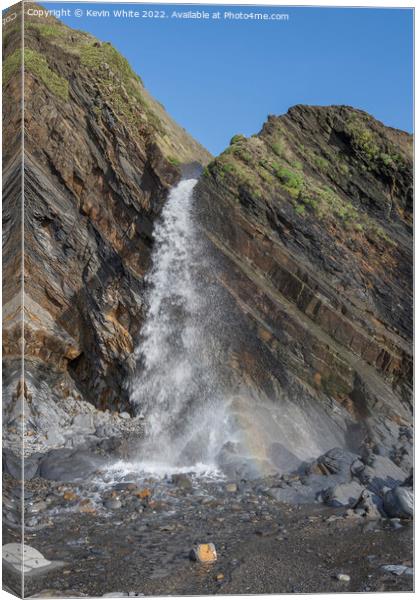 Waterfall on Sandymouth beach Canvas Print by Kevin White