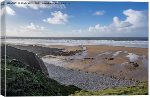 Low sunshine over Sandymouth beach Canvas Print by Kevin White