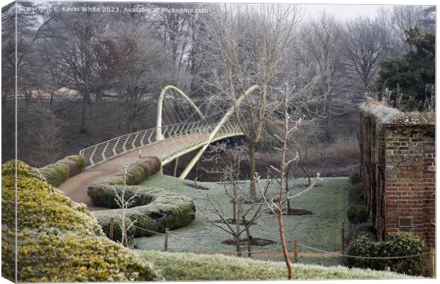 Painshill Park bridge across river past the walled garden Canvas Print by Kevin White