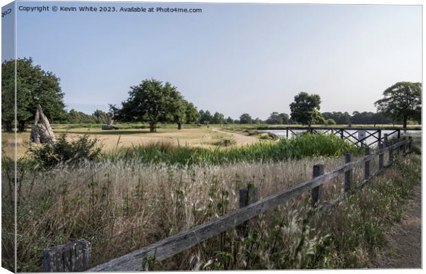 July view of Bushy park pond from carpark Canvas Print by Kevin White