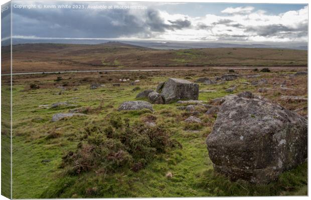 Rugged desolate Dartmoor with single road in background Canvas Print by Kevin White