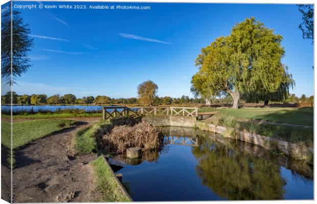 Little bridge across Bushy Park ponds in Surrey UK Canvas Print by Kevin White