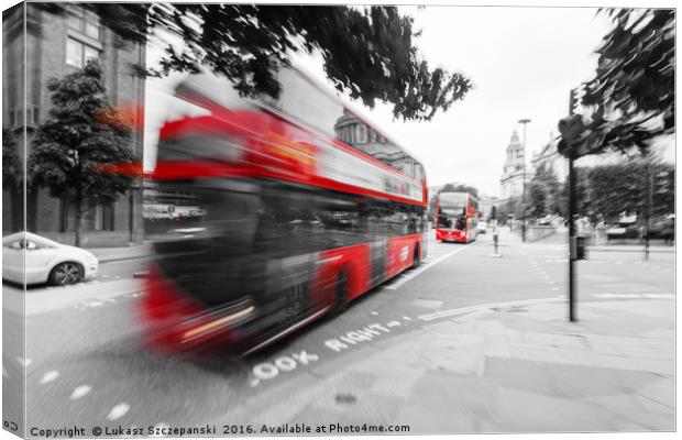 Red double-decker bus on the street of London Canvas Print by Łukasz Szczepański