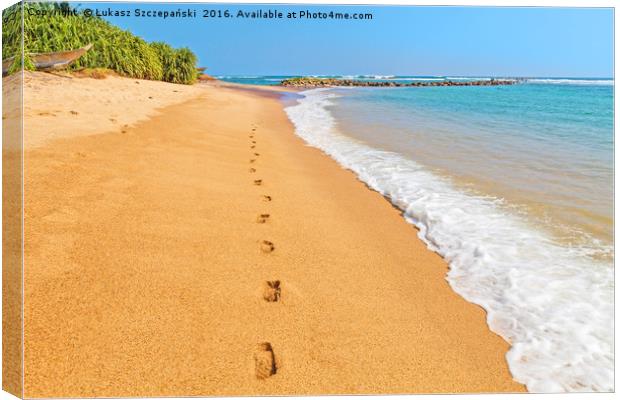 Footprints on a sandy beach by blue Indian Ocean Canvas Print by Łukasz Szczepański
