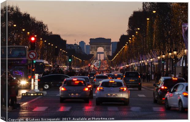 Traffic jam on Champs Elysees, Arc de Triomphe Canvas Print by Łukasz Szczepański