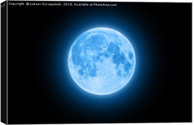 Blue super moon glowing with blue halo isolated on Canvas Print by Łukasz Szczepański