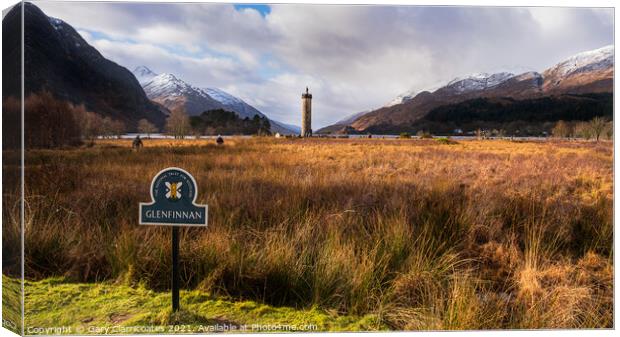 Glenfinnan Monument with snow capped mountains Canvas Print by Gary Clarricoates