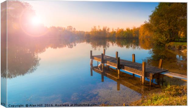 Single jetty on a calm lake Canvas Print by Alan Hill